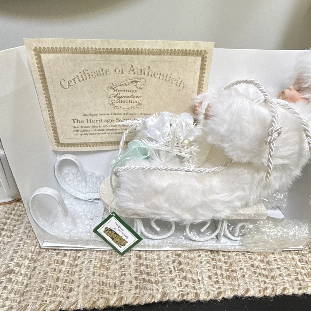 Heritage Signature Collection Winter Baby Porcelain Doll + Sleigh 8in MPN 80015